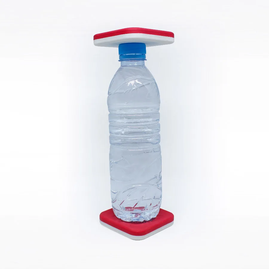 Bouteille placée entre deux palets magnétiques